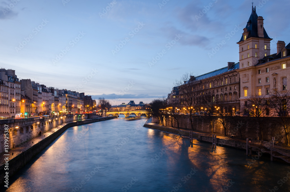 Paris scenic view on Seine and Pont Neuf at twilight