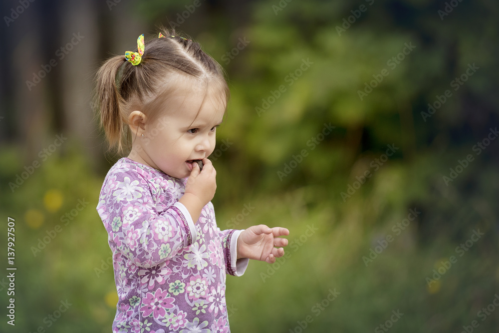 Children in the village walk in the tall grass Children in the village walk in the tall grass
