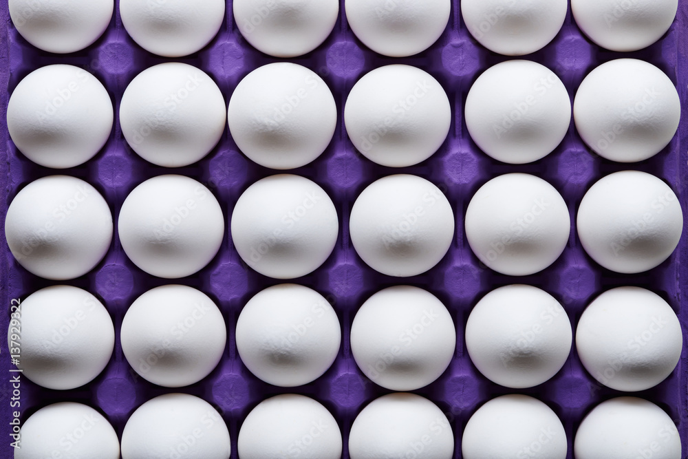 White eggs pattern in purple carton pack