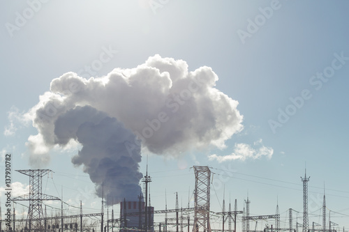 Cooling towers of NPP or Nuclear Power Plant with thick smoke © DedMityay
