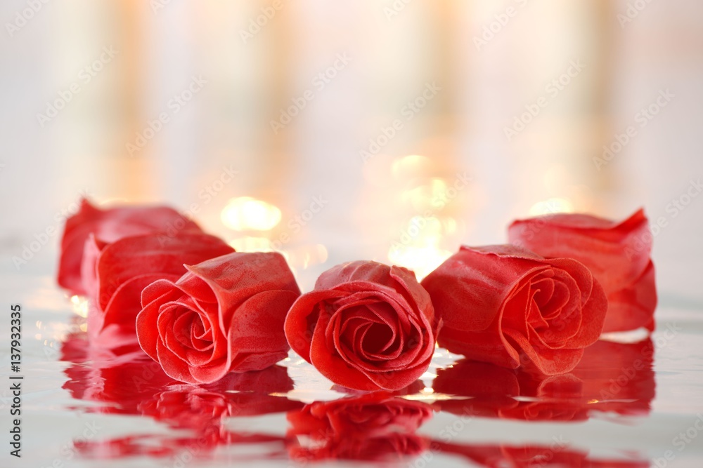 Red soap roses with reflection positioned in a circle Red soap roses with reflection positioned in a circle