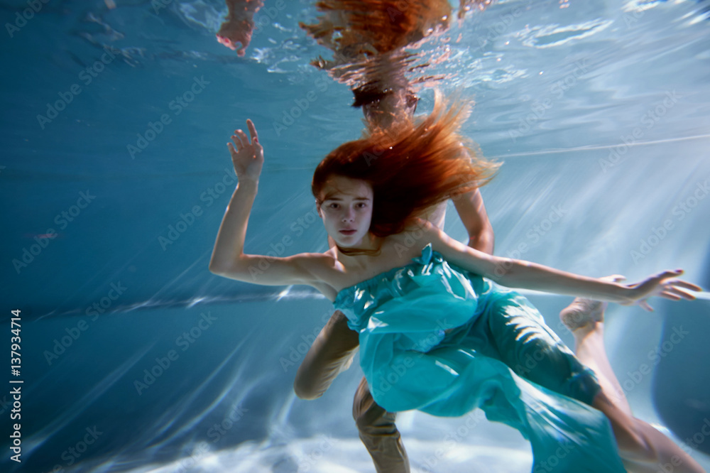 custom made wallpaper toronto digitalUnderwater in the pool with the purest water. Beautiful girl in a scarlet dress and flowing hair.