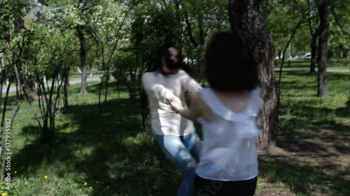 Happy three friends shoots old cinema in park city, slow motion, 4K UHD UltraHD