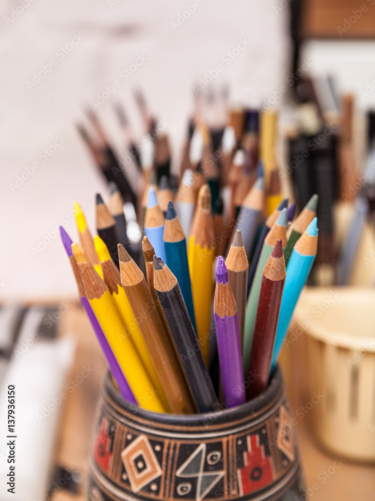 Colored wooden crayons in the graphic artist's worplace Colored wooden crayons in the graphic artist's worplace