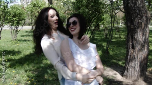 Happy three friends shoots old cinema in park city, slow motion, 4K UHD UltraHD