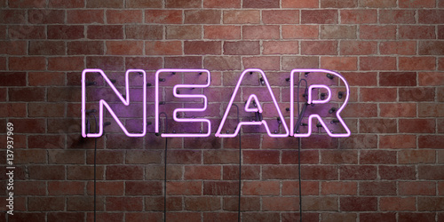 NEAR - fluorescent Neon tube Sign on brickwork - Front view - 3D rendered royalty free stock picture. Can be used for online banner ads and direct mailers..