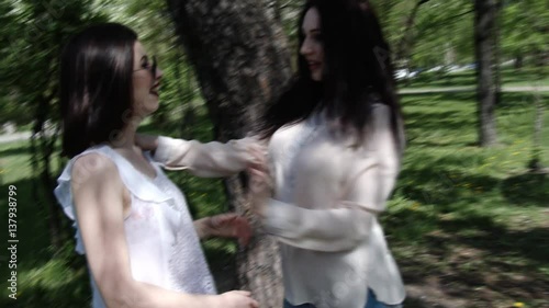 Happy three friends shoots old cinema in park city, slow motion, 4K UHD UltraHD