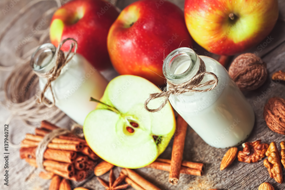 Healthy eating for weight loss: smoothie from red apples, banana, almonds and cinnamon, selective focus