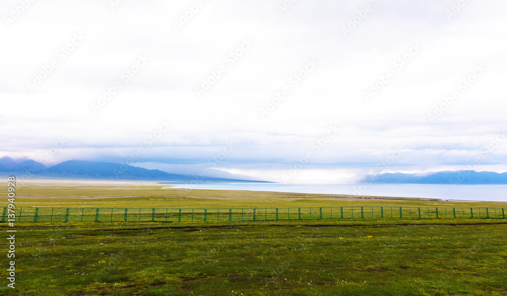 Sayram lake and snow mountains before rain