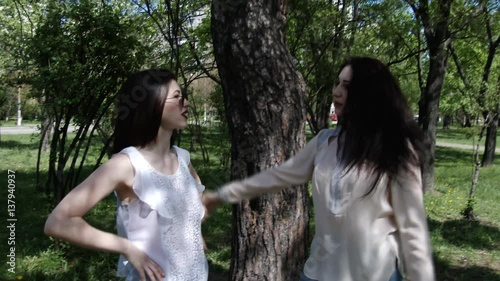 Happy three friends shoots old cinema in park city, slow motion, 4K UHD UltraHD