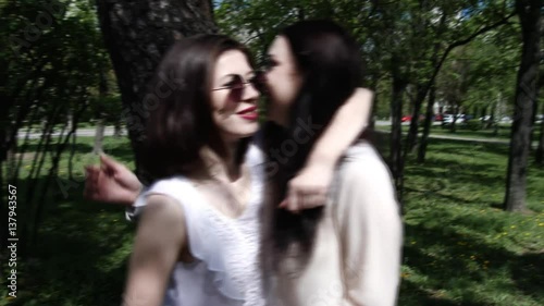 Happy three friends shoots old cinema in park city, slow motion, 4K UHD UltraHD