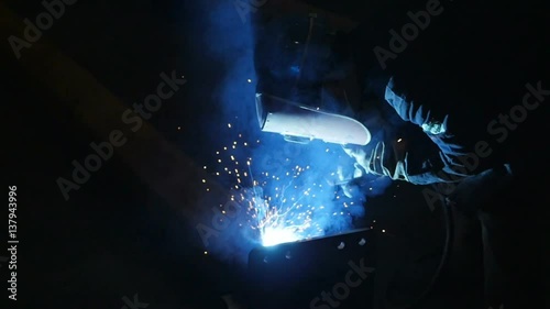 Welder at work in metal industry shot in slow motion 100fps