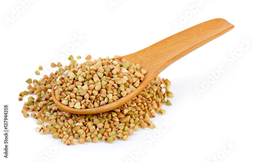 Buckwheat in spoon isolated on white background