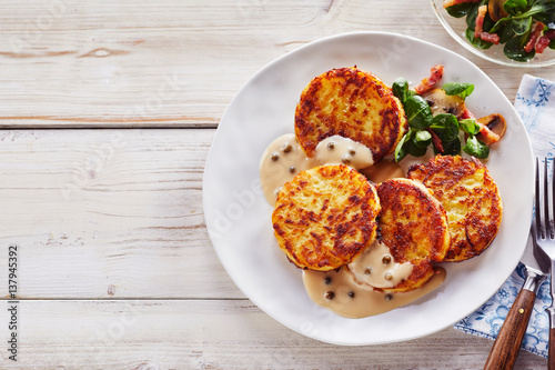 Crisp Potato Pancakes in Cream Sauce with Salad