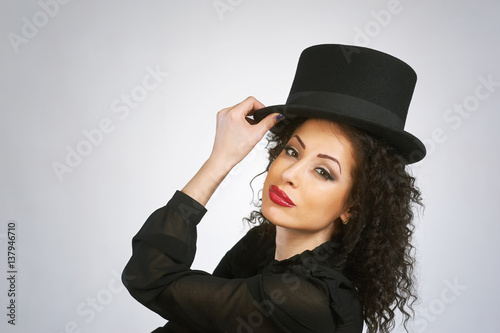 Beautiful woman in hat. Retro fashion.