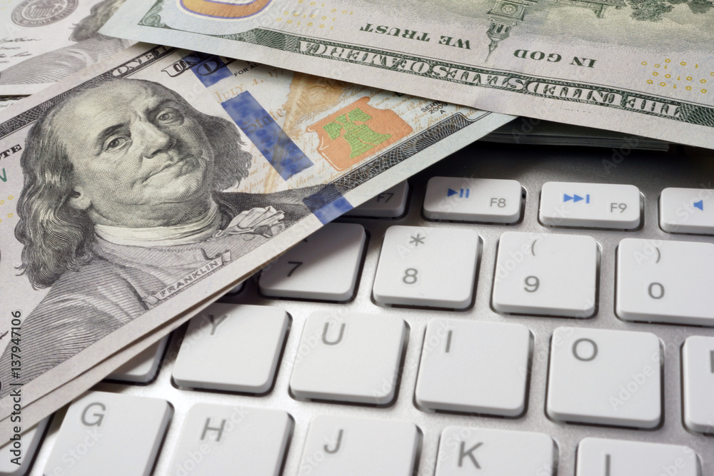 Keyboard and dollars. Online payments concept.