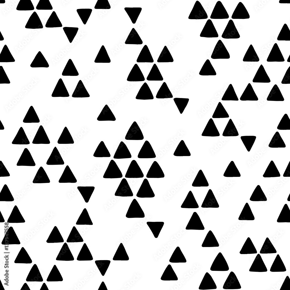 Seamless hand drawn geometric tribal pattern with triangles. Vector navajo design. Seamless hand drawn geometric tribal pattern with triangles. Vector navajo design.
