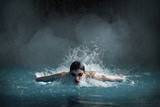 Swimmer man. Happiness swimming athlete swims distance in waterpool.