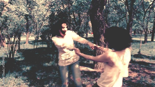 Happy three friends shoots old cinema in park city, slow motion, 4K UHD UltraHD