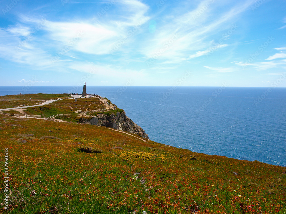 Cabo da Roca cape with blue ocean and sky in Portugal 青空のロカ岬遠景と青い海