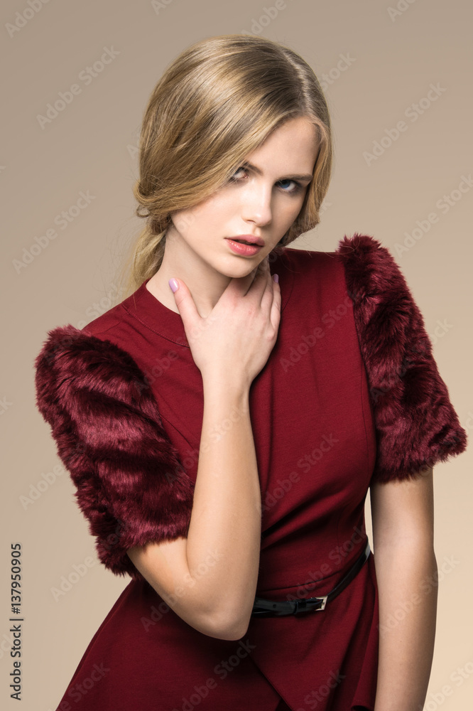beautiful blonde woman posing in burgundy dress beautiful blonde woman posing in burgundy dress