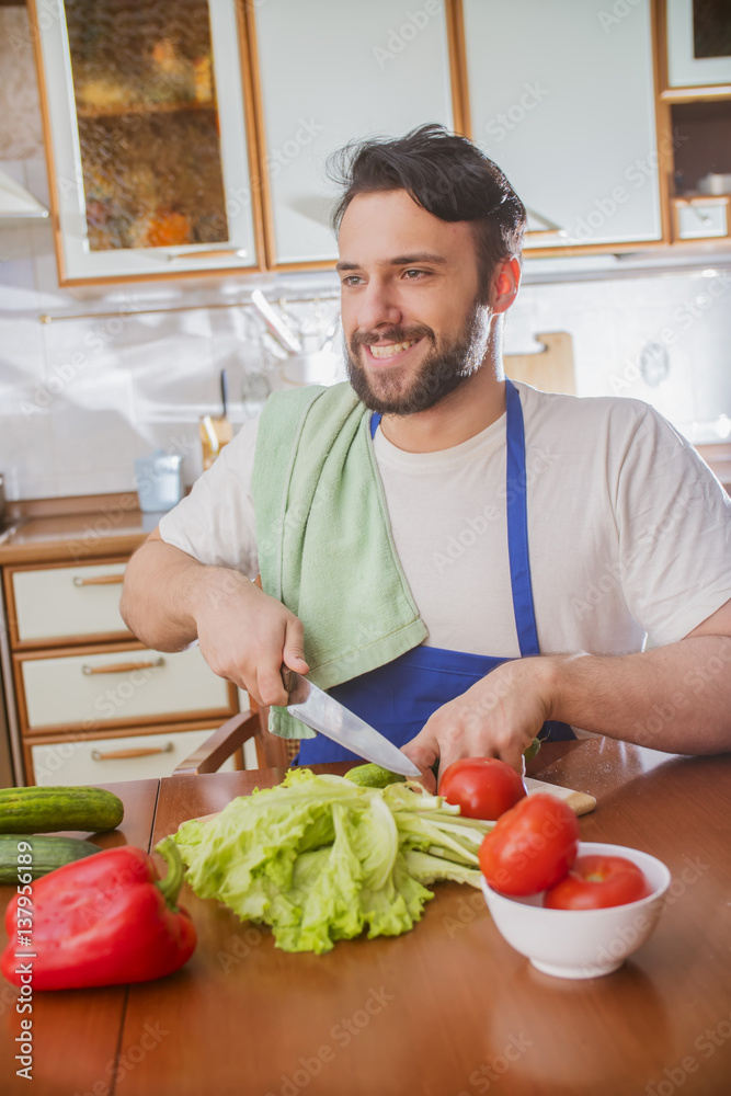a man cooks in the kitchen a man cooks in the kitchen