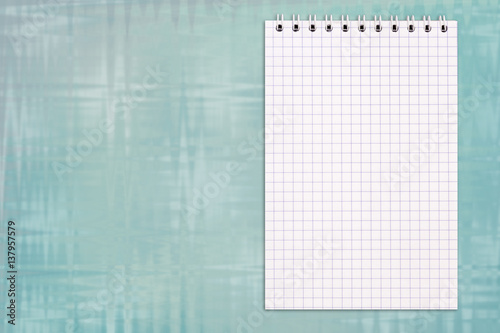 Blank notebook on a colorful glass background with copy space