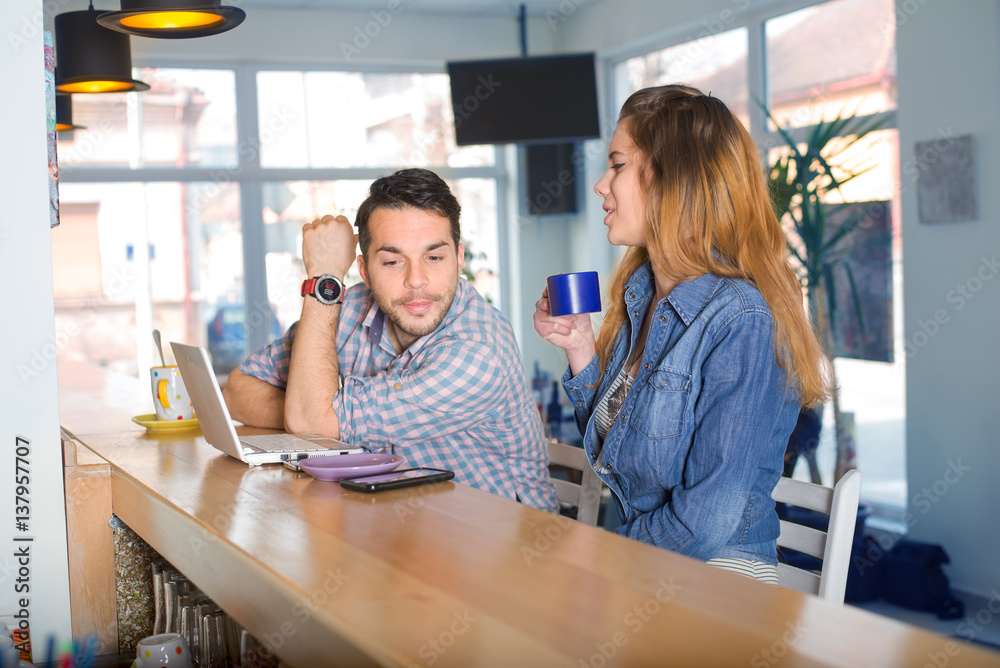 Couple enjoy in caffer restaurat.Colored photo