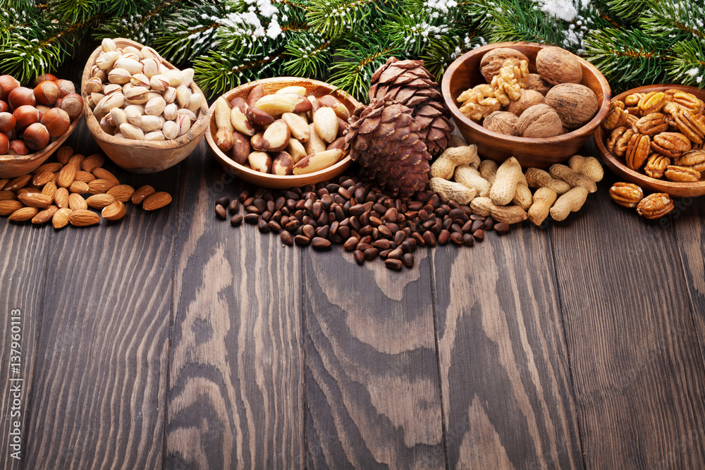 Various nuts on wooden table Various nuts on wooden table