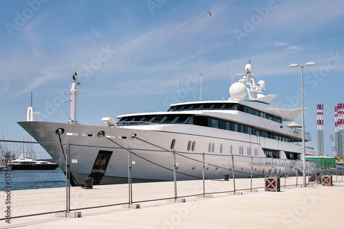 Large modern white yacht anchored in the port city Pula