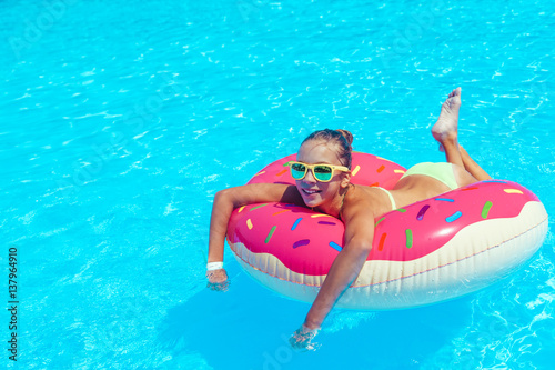 Tween girl in resort pool