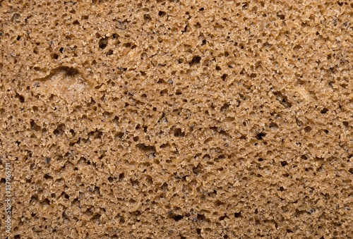 Brown bread, background texture. Macro shot.