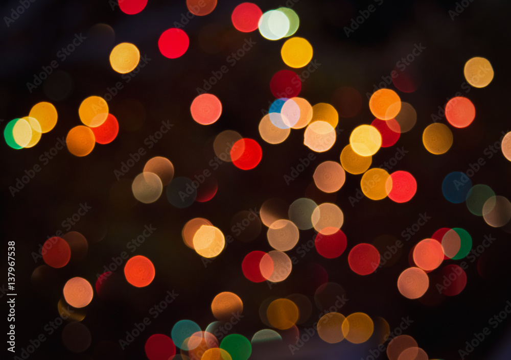Colorful bokeh glitter defocused lights abstract background.
