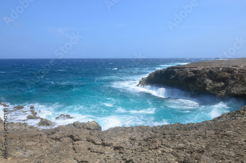 Waves Crashing on to the Lava Rock at Daimari Beach photo