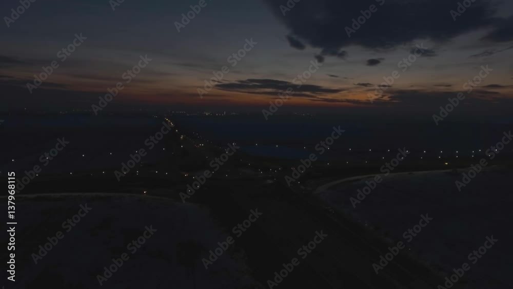 aerial view of traffic on the road crossing at dawn
aerial view of traffic on the road crossing at dawn