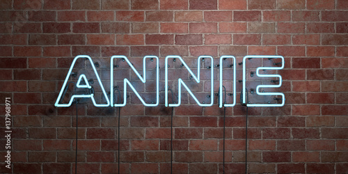 ANNIE - fluorescent Neon tube Sign on brickwork - Front view - 3D rendered royalty free stock picture. Can be used for online banner ads and direct mailers.. photo