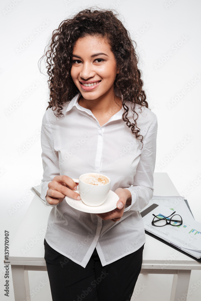 Happy african business woman wearing glasses drinking coffee Happy african business woman wearing glasses drinking coffee