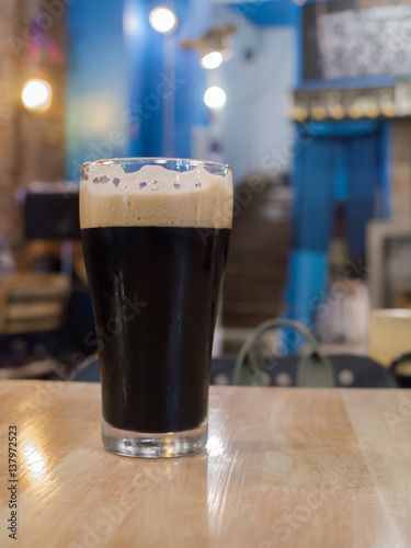 Glass of Stout beer in a bar