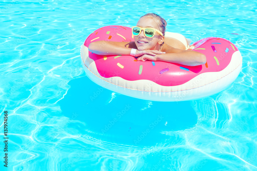 Tween girl in resort pool