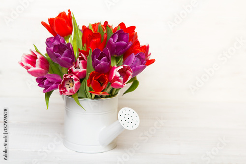 Tulip bouquet on wooden background, copy space