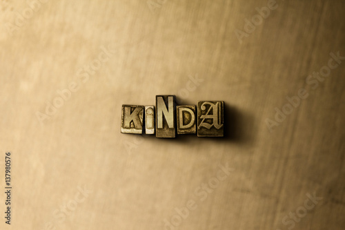 KINDA - close-up of grungy vintage typeset word on metal backdrop. Royalty free stock illustration. Can be used for online banner ads and direct mail. © Chris Titze Imaging