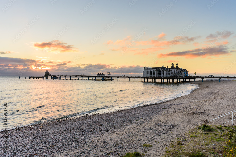 Sunrise on the beach of Sellin with a view of the famous pier. Sellin is located on the island Ruegen in the Baltic Sea.