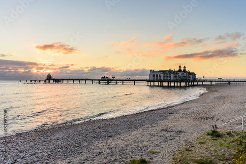 Sunrise on the beach of Sellin with a view of the famous pier. Sellin is located on the island Ruegen in the Baltic Sea.