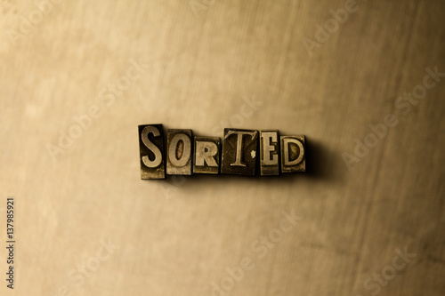 SORTED - close-up of grungy vintage typeset word on metal backdrop. Royalty free stock illustration.  Can be used for online banner ads and direct mail.