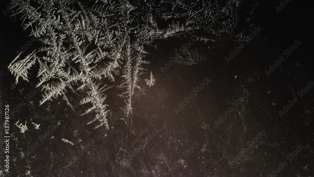 little frozen patterns disappear on dirty glass
