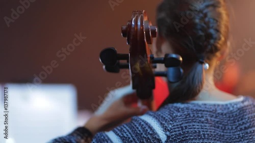 Woman playing the cello in concert. photo