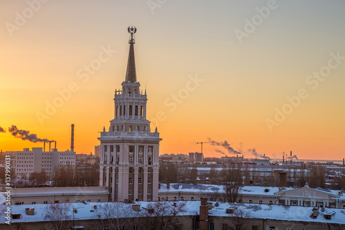 Evening Voronezh, tower in architecture Stalinist empire on background of crimson sunset
