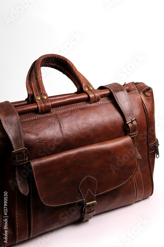 Luxury leather brown travel bag isolated on white background