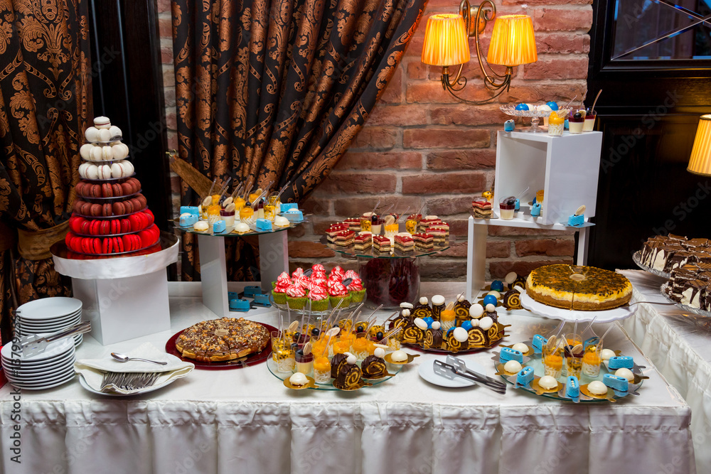 Sweet table for a wedding. Colorful table with sweets for the wedding