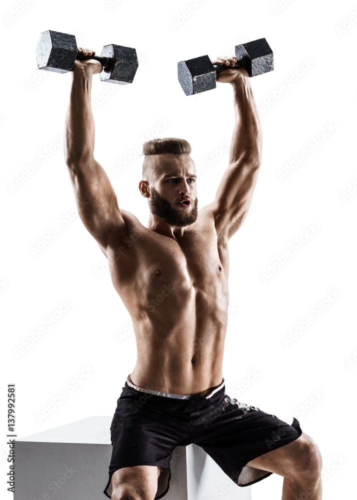 Muscular man working out with dumbbells. Photo of man isolated on white background. Strength and motivation. Muscular man working out with dumbbells. Photo of man isolated on white background. Strength and motivation.